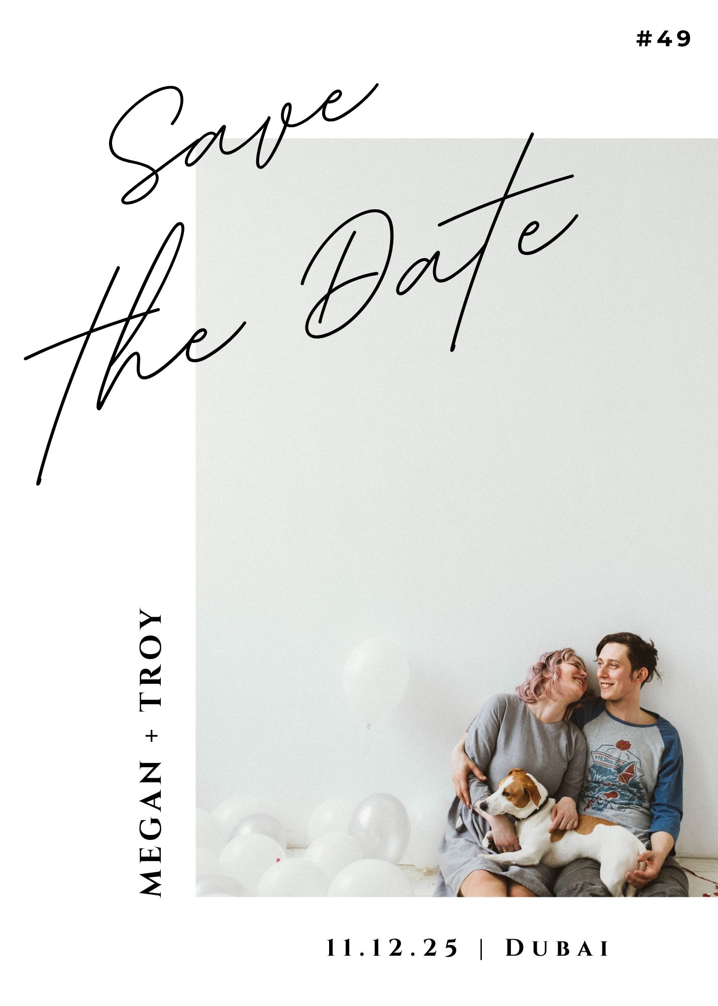 Minimal Save the Date invitation with Megan & Troy seated on the floor holding a dog