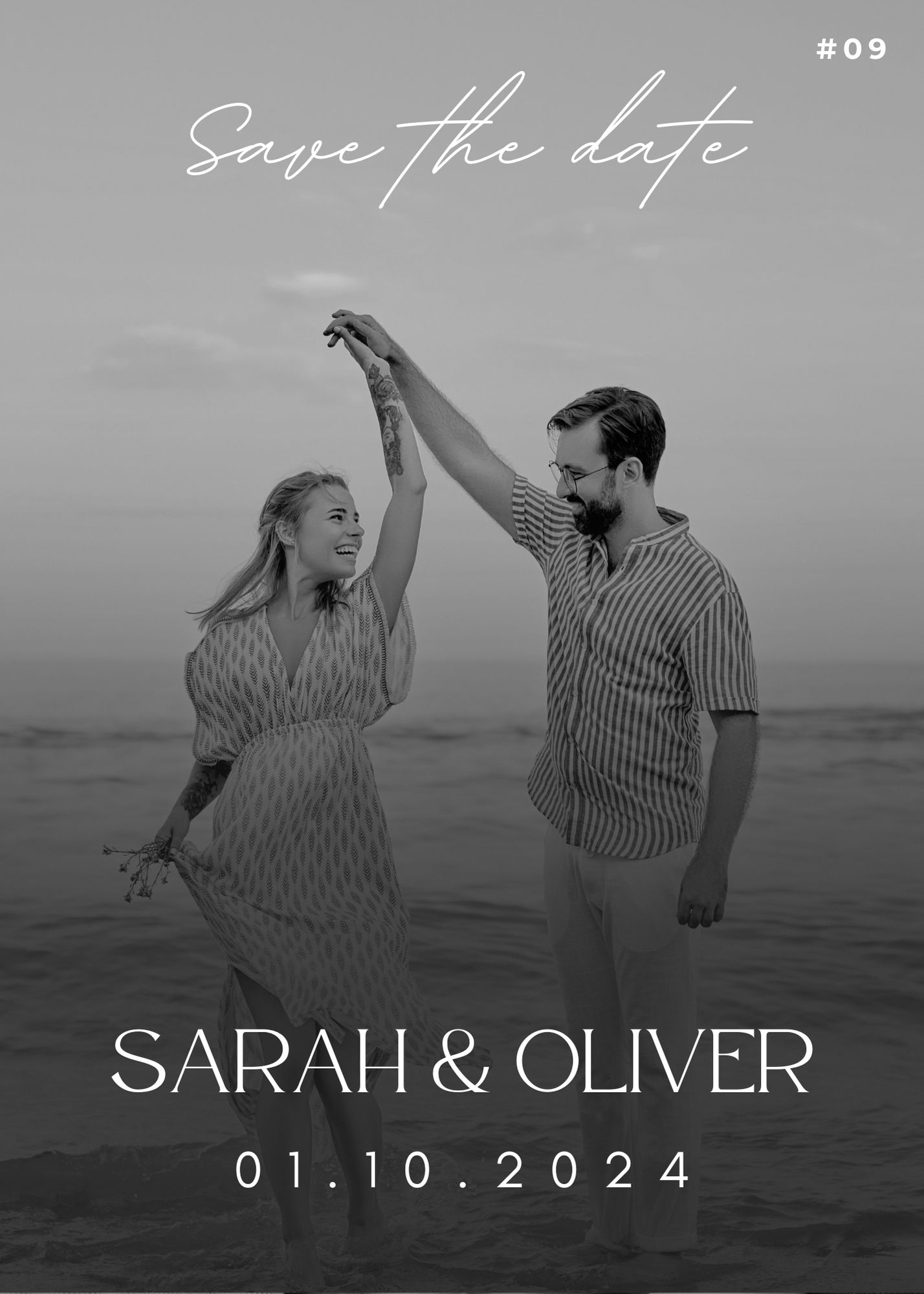 Black and white beach Save the Date with Sarah and Oliver dancing joyfully